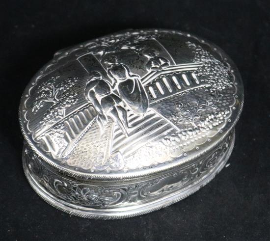 A 1950s repousse silver oval trinket box London, Assay Office, London, 1956, 3.75in.